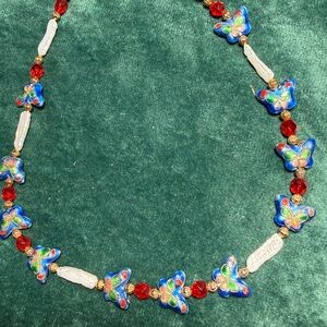 Necklace with cloisonné enamel beads, freshwater pearls, and red glass beads.